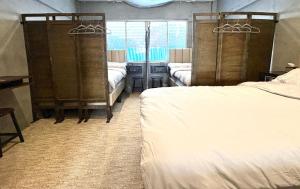Ein Bett oder Betten in einem Zimmer der Unterkunft Nonoteru Chiangmai
