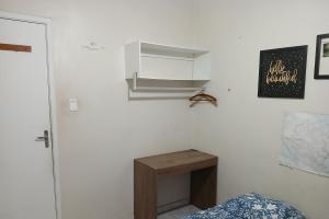 A bed or beds in a room at Quarto Privado Cama Casal ou Solteiros Apto