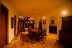 a dining room with a table and chairs at Villa Leela Bentota in Induruwa +51 photos
