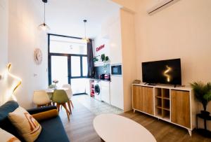 Televízia a/alebo spoločenská miestnosť v ubytovaní B2 Verdeguer - Cozy Loft close to the beach