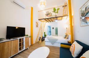 Televízia a/alebo spoločenská miestnosť v ubytovaní B2 Verdeguer - Cozy Loft close to the beach