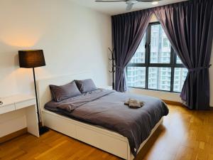 a bedroom with a bed and a large window at Teega Suites Puteri Harbour #Seaview Unit in Nusajaya +60 photos