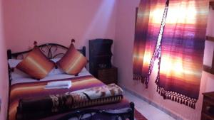 Ένα ή περισσότερα κρεβάτια σε δωμάτιο στο Hotel Souika