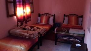 Ένα ή περισσότερα κρεβάτια σε δωμάτιο στο Hotel Souika