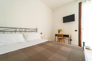 Postel nebo postele na pokoji v ubytování Casa Schiavoni
