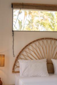 Voodi või voodid majutusasutuse Surf Lodge Madiha toas