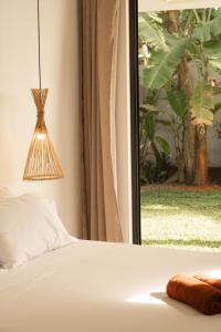 Voodi või voodid majutusasutuse Surf Lodge Madiha toas