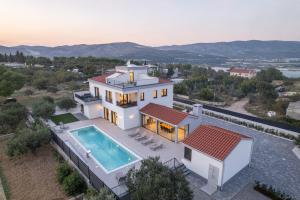 an aerial view of a house with a swimming pool at Villa Skyora in Trogir
