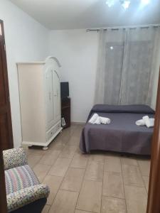 Postel nebo postele na pokoji v ubytování Casaimamà Viola