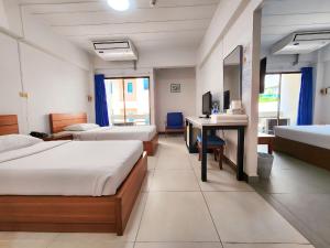 Postel nebo postele na pokoji v ubytování Siam Palace Hotel