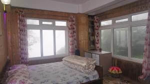 Postel nebo postele na pokoji v ubytování Tranquil Retreat Homestay