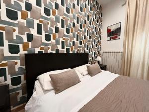 Ένα ή περισσότερα κρεβάτια σε δωμάτιο στο La Corte degli Spada - Borgo Antico del Salento +57 φωτογραφίες