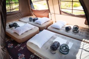 Postel nebo postele na pokoji v ubytování Camp Lù Yīng