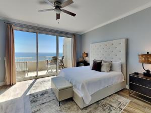 a bedroom with a large bed and a large window at The Beach Club - Catalina Penthouse #2 in Gulf Highlands +32 photos