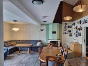 a living room with a couch and a table at Willa Ostrzyce in Ostrzyce