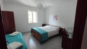 Postel nebo postele na pokoji v ubytování Villa Bianca