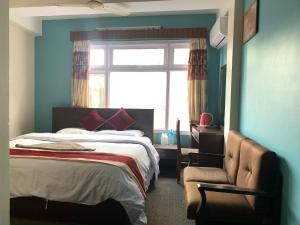Postel nebo postele na pokoji v ubytování Hotel Discovery Inn