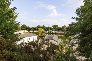 a view of the river from the trees at Stunning Lodge With Decking At Oaklands Holiday Park In Essex Ref 39017Rw in Clacton-on-Sea