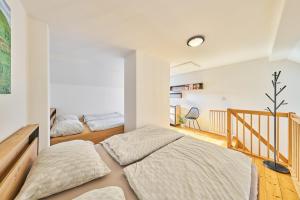A bed or beds in a room at Apartmán - Dovolená Mladé Buky
