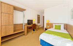 Voodi või voodid majutusasutuse Sapia Hotel St. Fridolin toas