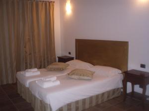 Postel nebo postele na pokoji v ubytování Agriturismo Le Case Di Campagna