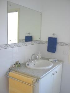 a bathroom with a sink and a mirror at Lindsays of Kangaroo Island in Penneshaw