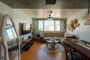 a living room with a couch and a table at Viors Staycation in Cainta
