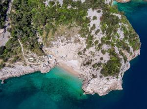 an aerial view of an island in the water at Chic and Cozy Brsec Apartment with Sea View in Brseč