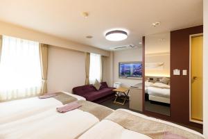 Postel nebo postele na pokoji v ubytování Inuyama Miyako Hotel