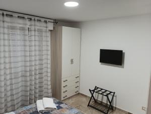 TV a/nebo společenská místnost v ubytování A casa di Elena e Francesco