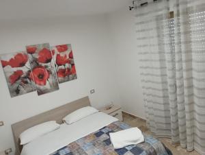 Postel nebo postele na pokoji v ubytování A casa di Elena e Francesco