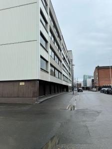 an empty street in front of a building at Arctic Jaakko Suite in Rovaniemi