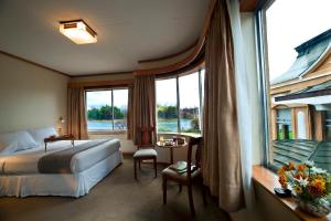 Postel nebo postele na pokoji v ubytování Hotel Naguilan