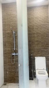 a bathroom with a toilet and a shower at Bukit Timah master room in Singapore +13 photos