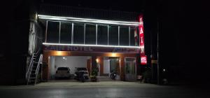 a garage with a car hotel at night at Zain Hotel Abbottabad in Abbottabad