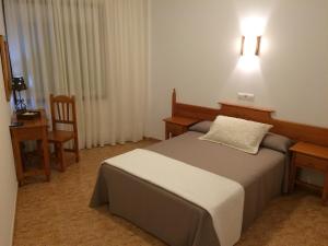 Posteľ alebo postele v izbe v ubytovaní Hostal Eden