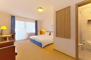 Voodi või voodid majutusasutuse Sapia Hotel St. Fridolin toas