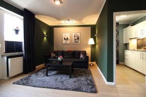 a living room with a couch and a table at La Bella Vita in Emden