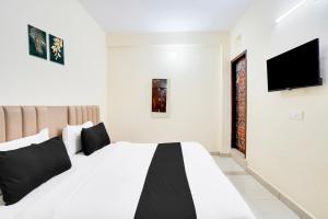 Voodi või voodid majutusasutuse Hotel O YATRA INN toas