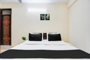 Voodi või voodid majutusasutuse Hotel O YATRA INN toas