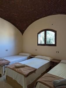 Postel nebo postele na pokoji v ubytování Cafour House Siwa - Hot Spring + 37 fotografií