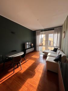a living room with a couch and a table at La dimora del Marchese in Duomo in Milan