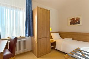 Voodi või voodid majutusasutuse Sapia Hotel St. Fridolin toas