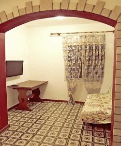 a room with a desk and a chair and a window at Holiday House Vis Pavic in Vis