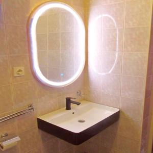 a bathroom with a sink and a mirror at Holiday House Vis Pavic in Vis +9 photos