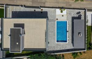 an overhead view of a house with a swimming pool at Villa Gina in Sukošan