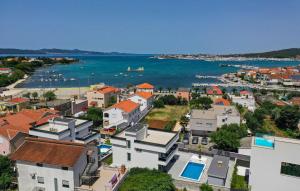 an aerial view of a town next to the water at Villa Gina in Sukošan