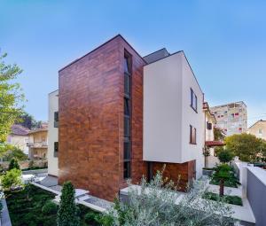 a brick house with a white facade at Residence by Vestibul Palace in Split