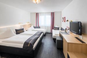 Postel nebo postele na pokoji v ubytování 4-Länder-Hotel Deutschmann