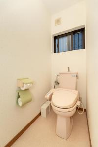 a bathroom with a toilet and a window at Osaka Kanzakigawa Royal駅徒步1分 "private house 3 bed rooms "一棟貸し宿 in Osaka +27 photos